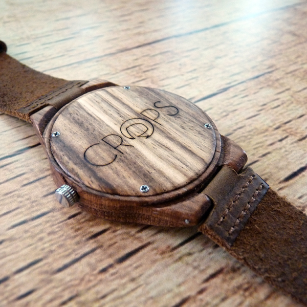 Wooden watch with engraved message, advertising agency
